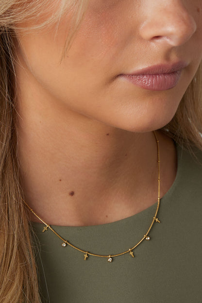 Goud Celeste Cross Charm Ketting RVS Goud – detail close-up | Tudor Gems