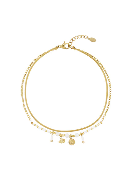 Goud & Roze Enkelbandje RVS Roze, Paars & Wit Goud – lifestyle shot | Tudor Gems