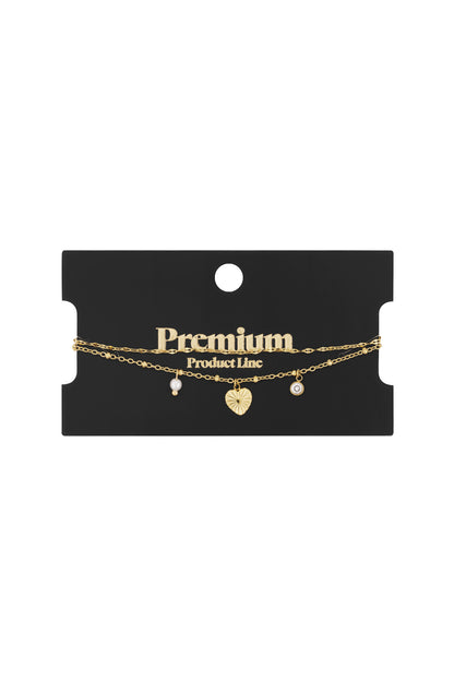 Goud Amore Layered Bedel Armband RVS Goud – gedragen op model | Tudor Gems